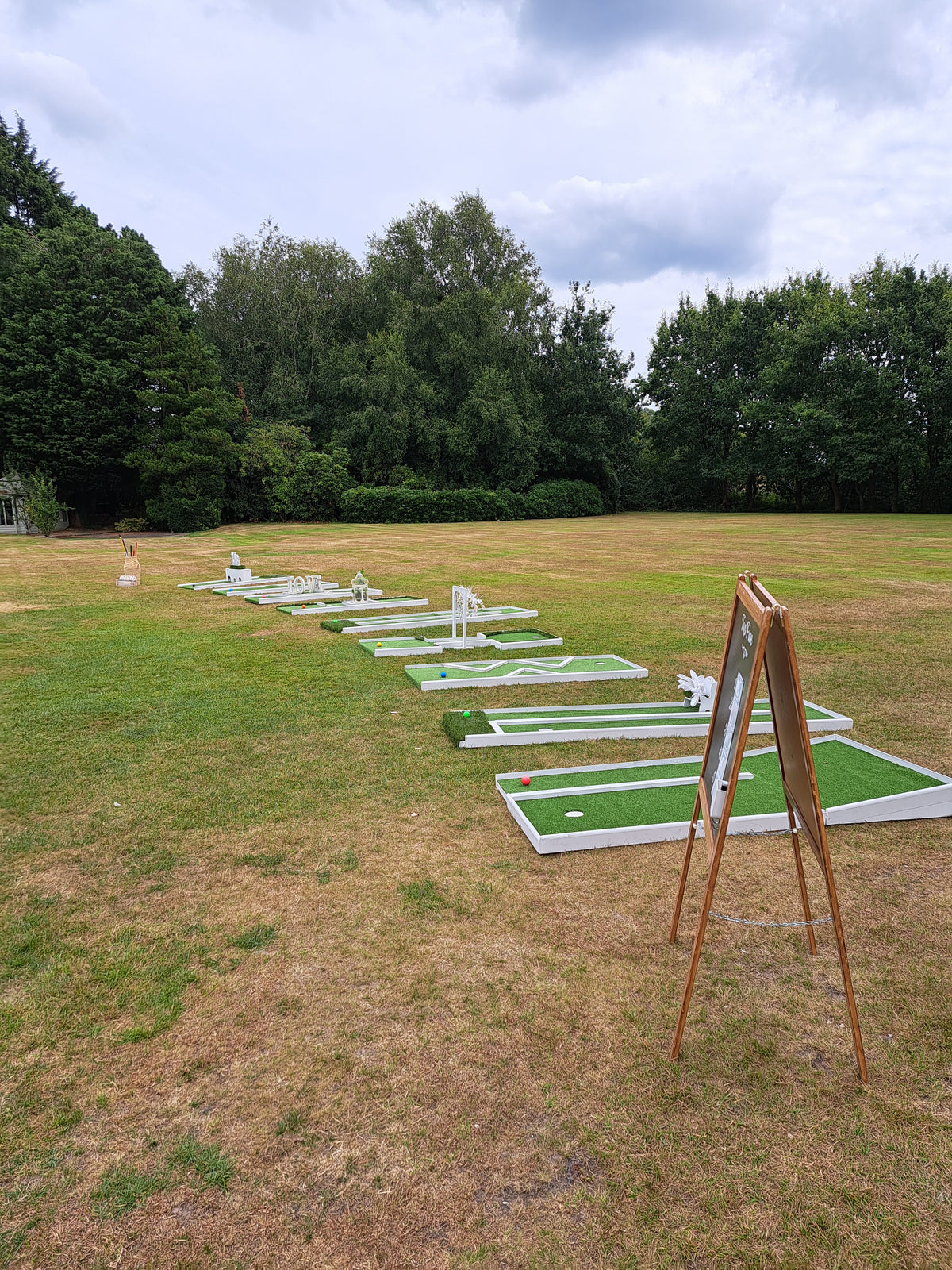 9 hole wedding mini golf set on a lawn at Bartle Hall Hotel, Bartle